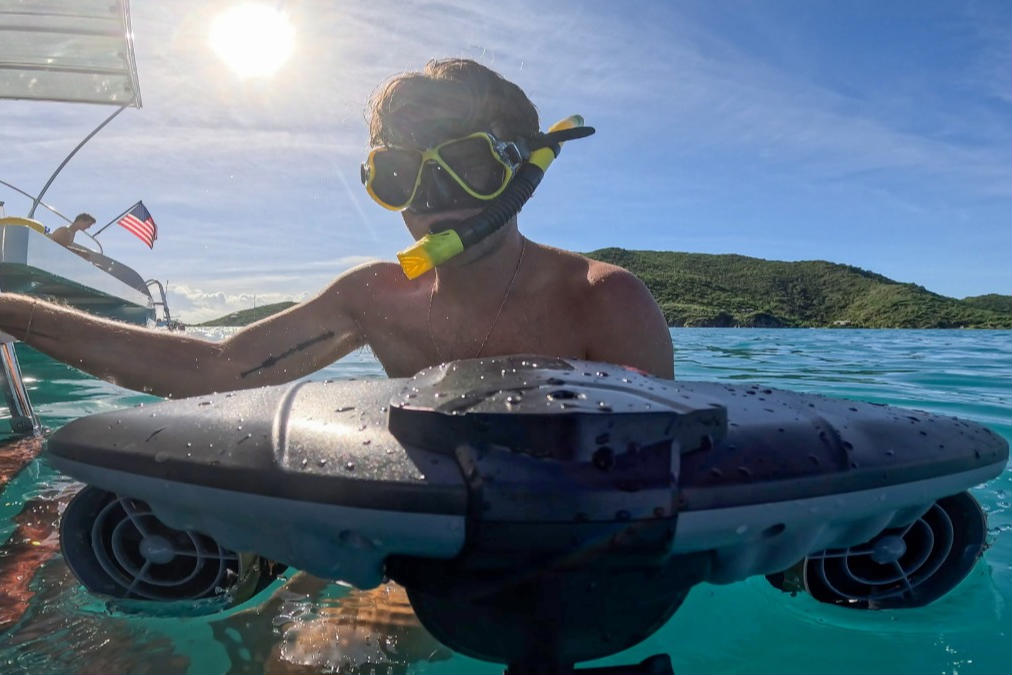 Person snorkeling with a sea scooter